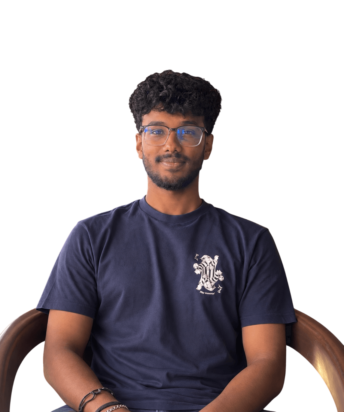 Midhunan, smiling, wearing glasses and a navy t-shirt